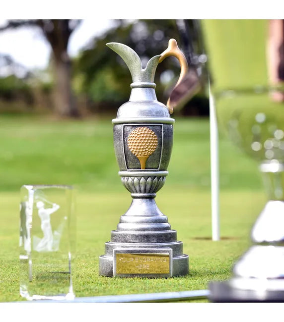 Golf trophy with a golf ball design on a grassy background