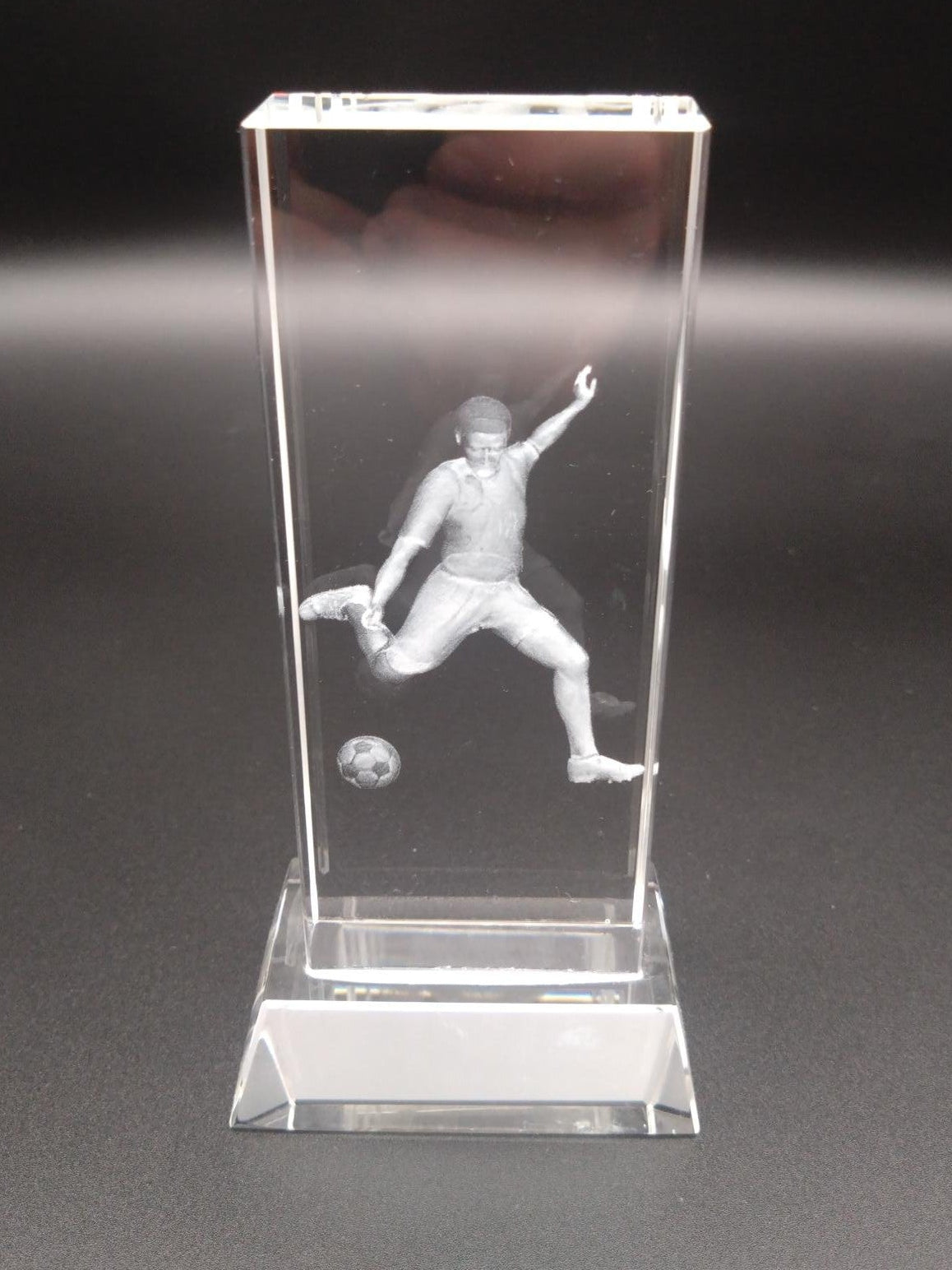 Glass football block award with 3D player kicking ball