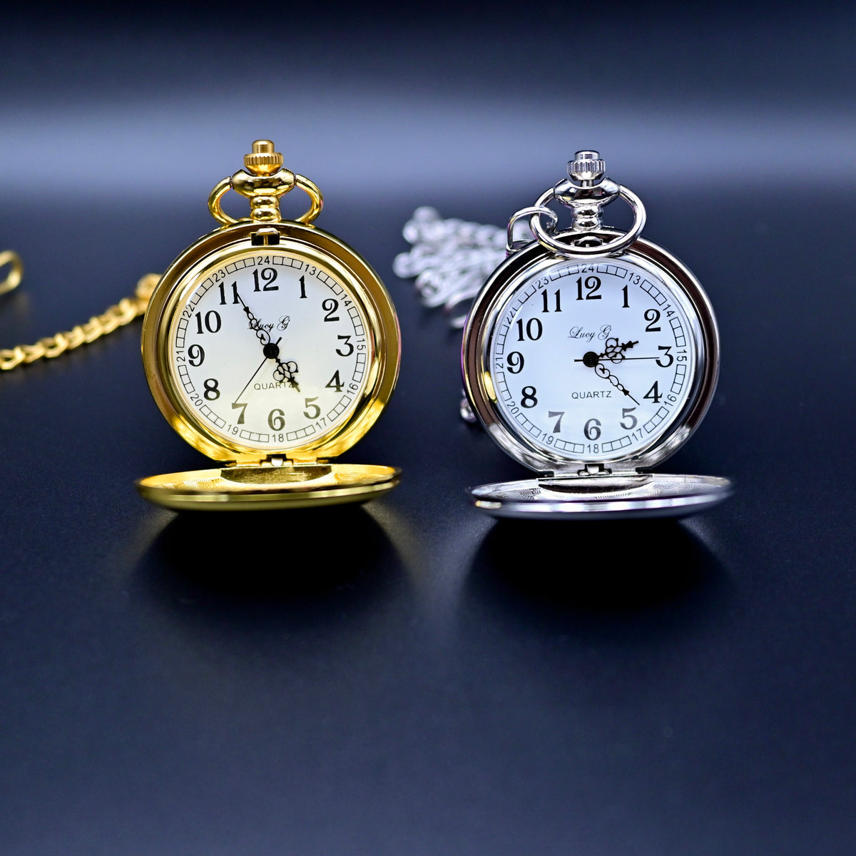 Gold and silver pocket watches on a dark background