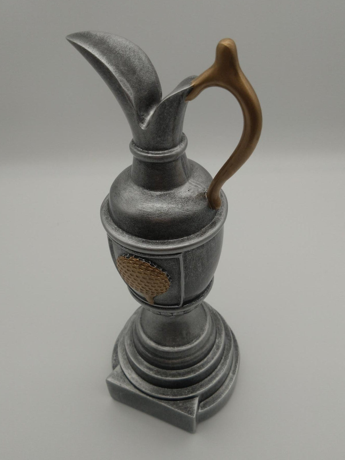 Golf trophy on white background