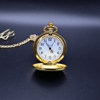 Gold pocket watch with a chain on a dark background