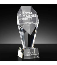 Crystal award with engraved text on a black background