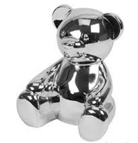 Silver plated teddy bear money box with a shiny, reflective surface.