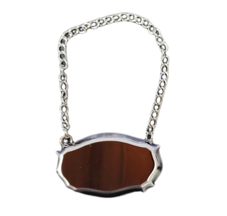 Stainless steel decanter label with chain on white background