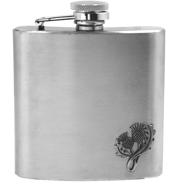 6oz stainless steel hip flask with pewter thistle badge on bottom right corner.